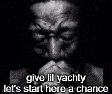 a black and white photo of a man with a beard and the words give lil yachty let 's start here a chance