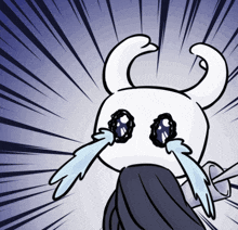 a cartoon character with horns is crying with tears running down its face