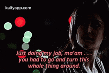 a woman is standing in front of a bunch of lights and says just doing my job ma 'am .