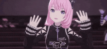 a girl with pink hair and purple eyes is wearing a black and white outfit .