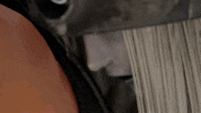 a close up of a person 's face and hair being cut