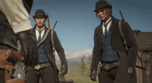 three men in suits and hats are standing in a field