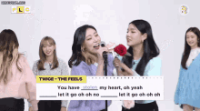 a group of girls are singing twice the feels