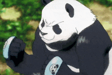 a panda bear is wearing a black and white outfit with a skull on it 's arm .