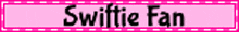 a pink sign that says swiftie fan is blurred