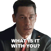 a man in a suit and tie asks " what is it with you "