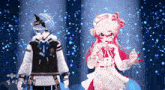 a boy and a girl are standing next to each other and the girl is wearing a pink dress