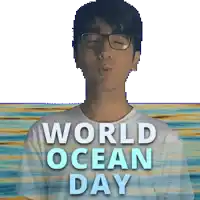 a man wearing glasses is blowing a kiss in front of a poster for world ocean day