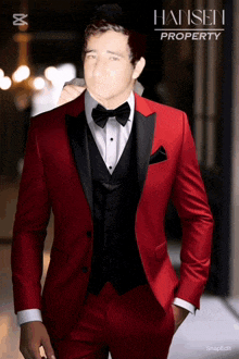 a man in a red tuxedo with hansen property on the bottom