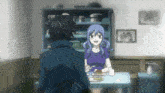 a man and a woman are sitting at a table with food on it