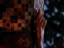 a close up of a woman 's face in a dark room with a blurry background .