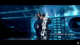 a man playing a trombone while a woman sings into a microphone