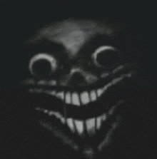 a black and white drawing of a creepy clown with a big smile