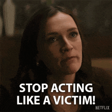 a woman says " stop acting like a victim " in a netflix ad