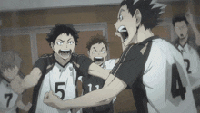 a group of volleyball players with one wearing a number 5 jersey
