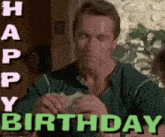 a man is eating a hamburger and the words happy birthday are behind him