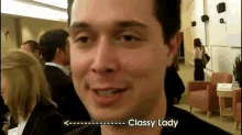 a man says classy lady in front of a crowd of people