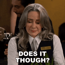 a woman says does it though while holding a glass of wine