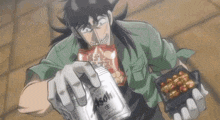 a man is holding a can of asahi beer in his hand