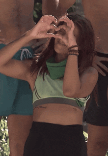 a woman with a tattoo on her arm that says tt