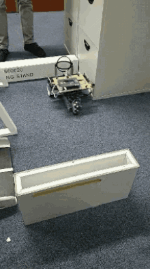 a box that says ng stand on it is on the floor