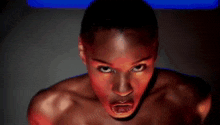 a woman without a shirt is making a funny face with her mouth open