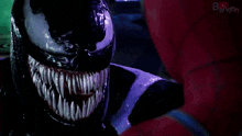 a close up of venom 's mouth with a red tongue sticking out