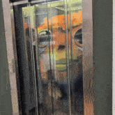 an elevator with a shrek sticker on the door