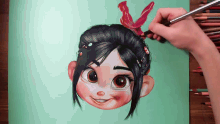 a person is drawing a girl with a red bow on her head