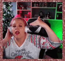 a woman wearing headphones is wearing a shirt that says " maybe christmas "