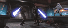 two people are fighting with lightsabers in a room while a storm trooper is standing in the background .