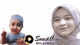 a woman in a hijab is standing next to a baby with the words snack video big family below them