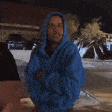 a blurry picture of a person wearing a blue jacket