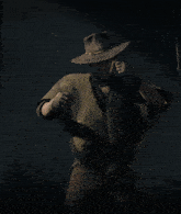 a man wearing a cowboy hat and a poncho with fringe