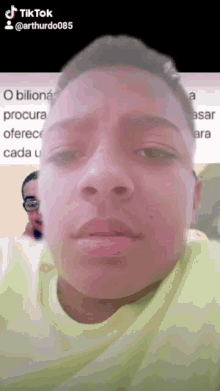 a close up of a person 's face with a tiktok logo on the bottom