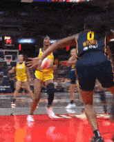 a female basketball player wearing a number 0 jersey