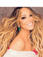 a woman with long blonde hair is wearing earrings and smiling