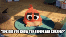 a red angry bird is sitting on a blue rug and says " hey did you know the aretes are cursed " .