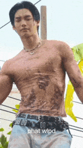 a man with a tattoo on his chest is wearing a shirt that says phat wlpd on it