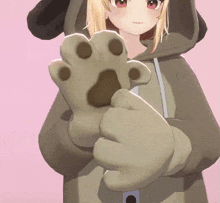 a 3d anime girl is wearing a dog hoodie and holding a paw in her hand .
