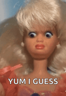 a close up of a barbie doll with the words yum i guess written below it