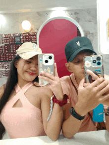 a man and a woman are taking a selfie together