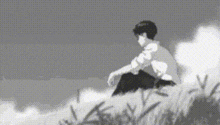 a black and white drawing of a man sitting on a hill .