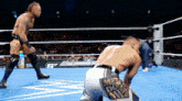 two men are wrestling in a ring and one has a patch on his shorts that says mr. do me