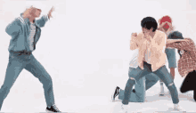 a group of men are dancing together in a room .