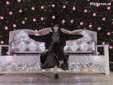 a woman stands on one leg on a bench with pixverse.ai written on the bottom