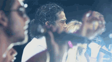 a gif of a man kissing a woman with the words red.gif visible