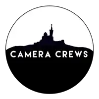 a logo for camera crews with a statue on top of a hill