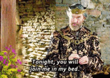 a man in a crown says " tonight you will join me in my bed "