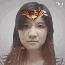 a woman wearing a wonder woman headband on her head